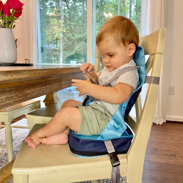 Stylish portable baby high chair travel bag, easy storage & transport. Perfect baby gear for travel.