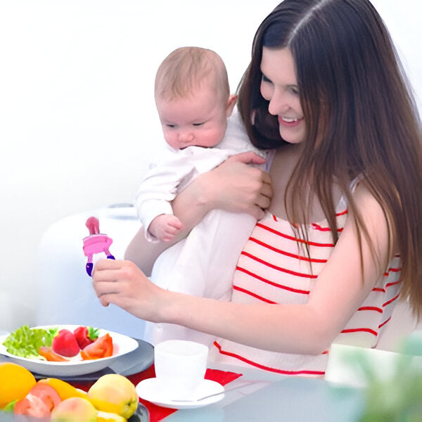 Adorable baby using soothing fruit-flavored teether pacifier.  Natural, safe materials.  Perfect for teething relief.